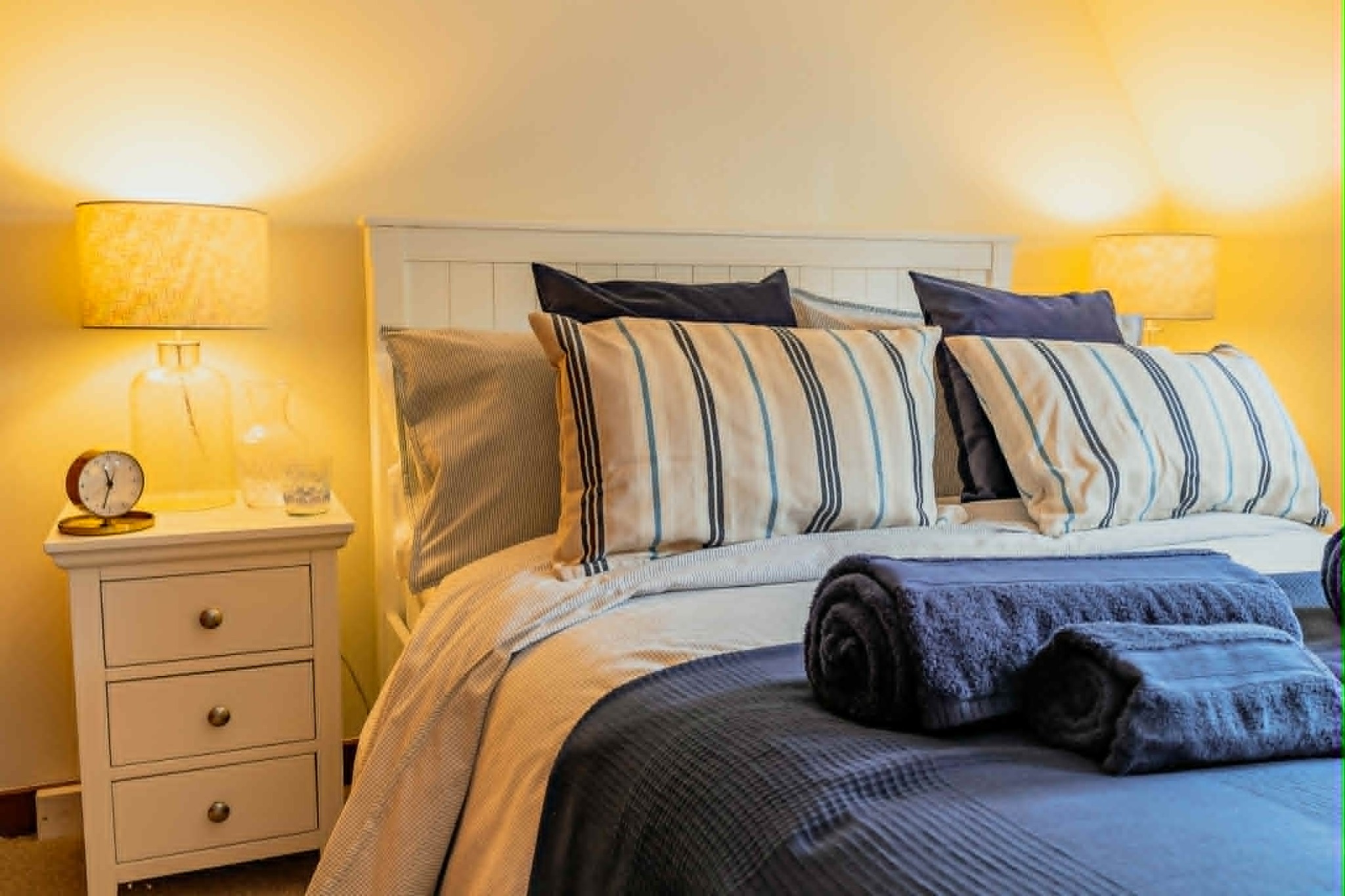Warmly lit double bedroom