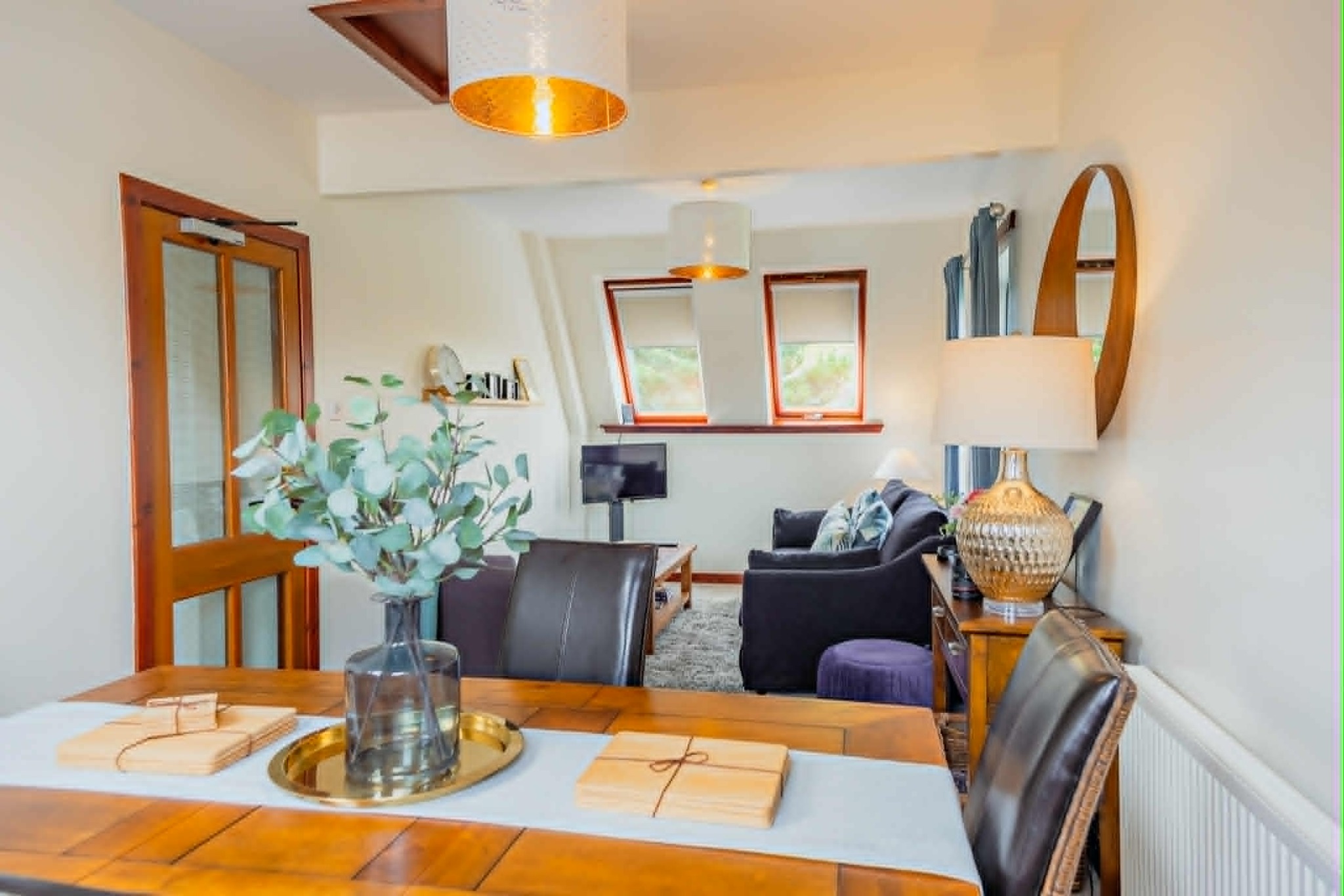 The bright open-plan dining and living room in a Quay House apartment