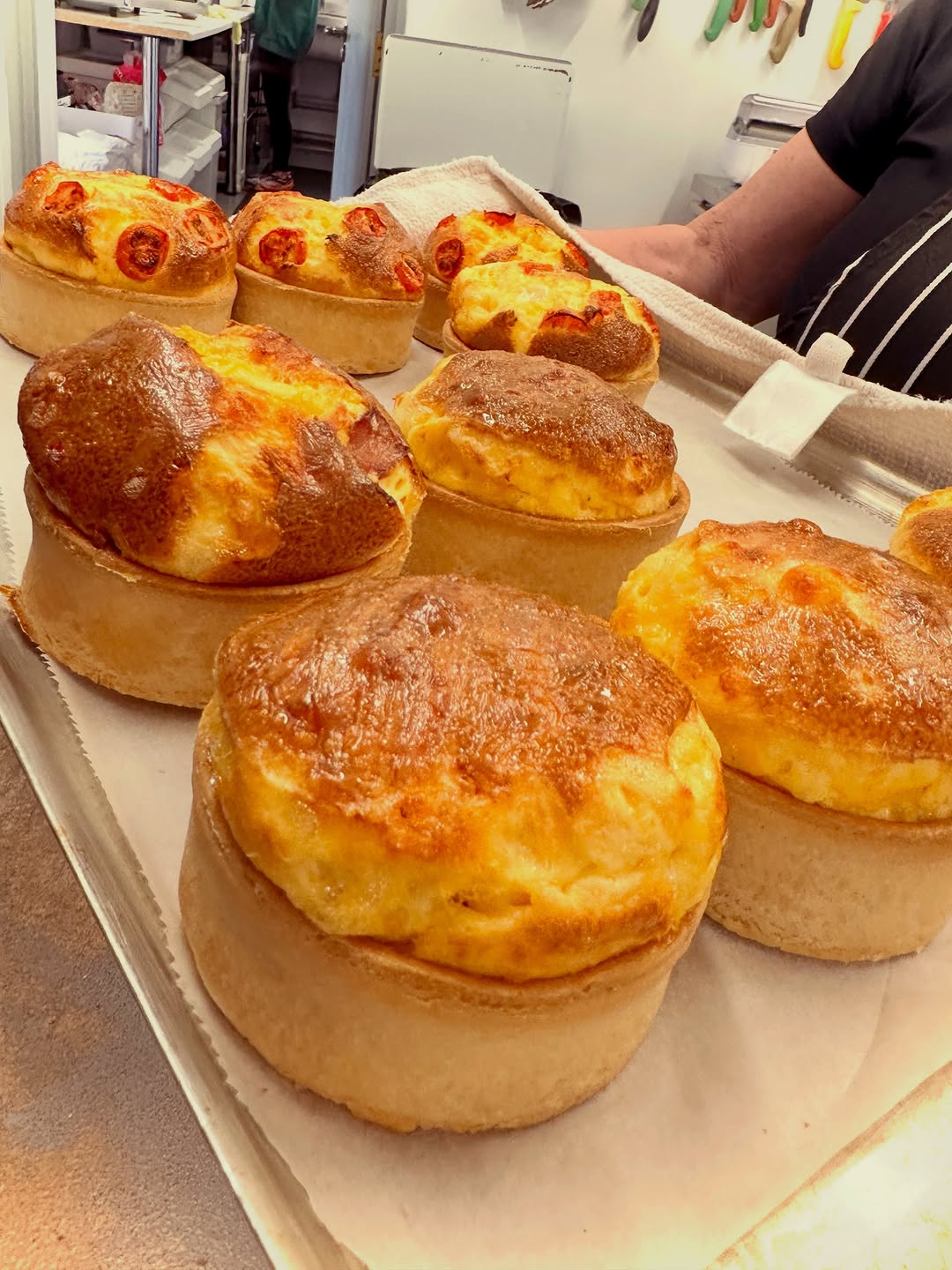 Golden homemade quiches ready for lunch